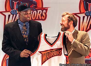 WARRIORS/26JUN97/SP/FRL:  Warriors 1st round 1997 draft pick Adonal Foyle out of Colgate poses with Warriors head coach P.J. Carlesimo.  Chronicle photo by Frederic Larson.